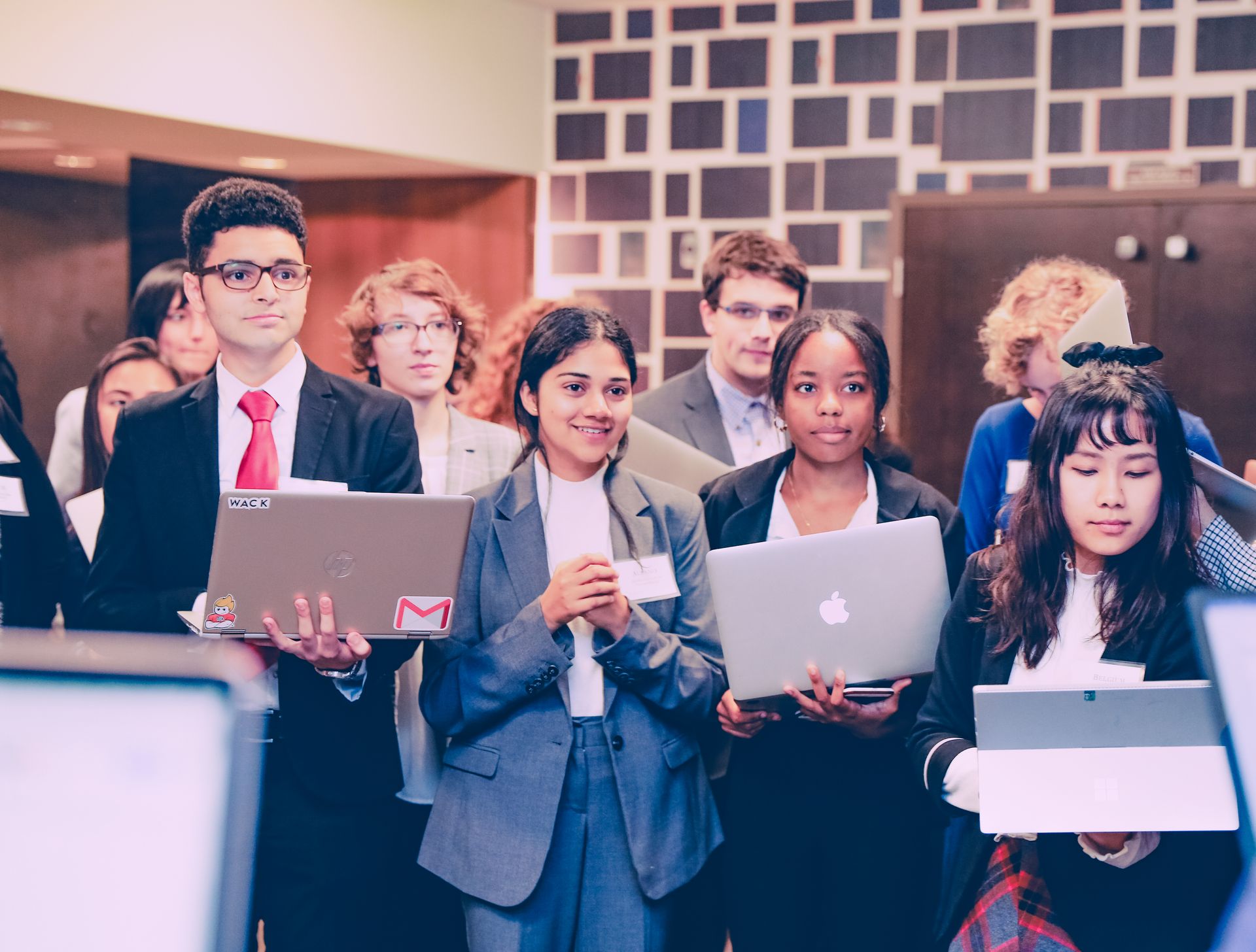 NWMUN delegates gathered together with laptops during a conference